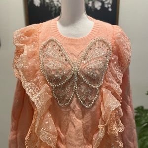 Knit sweater with embroidery butterfly